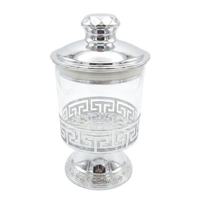 Footed glass jar with silver lid